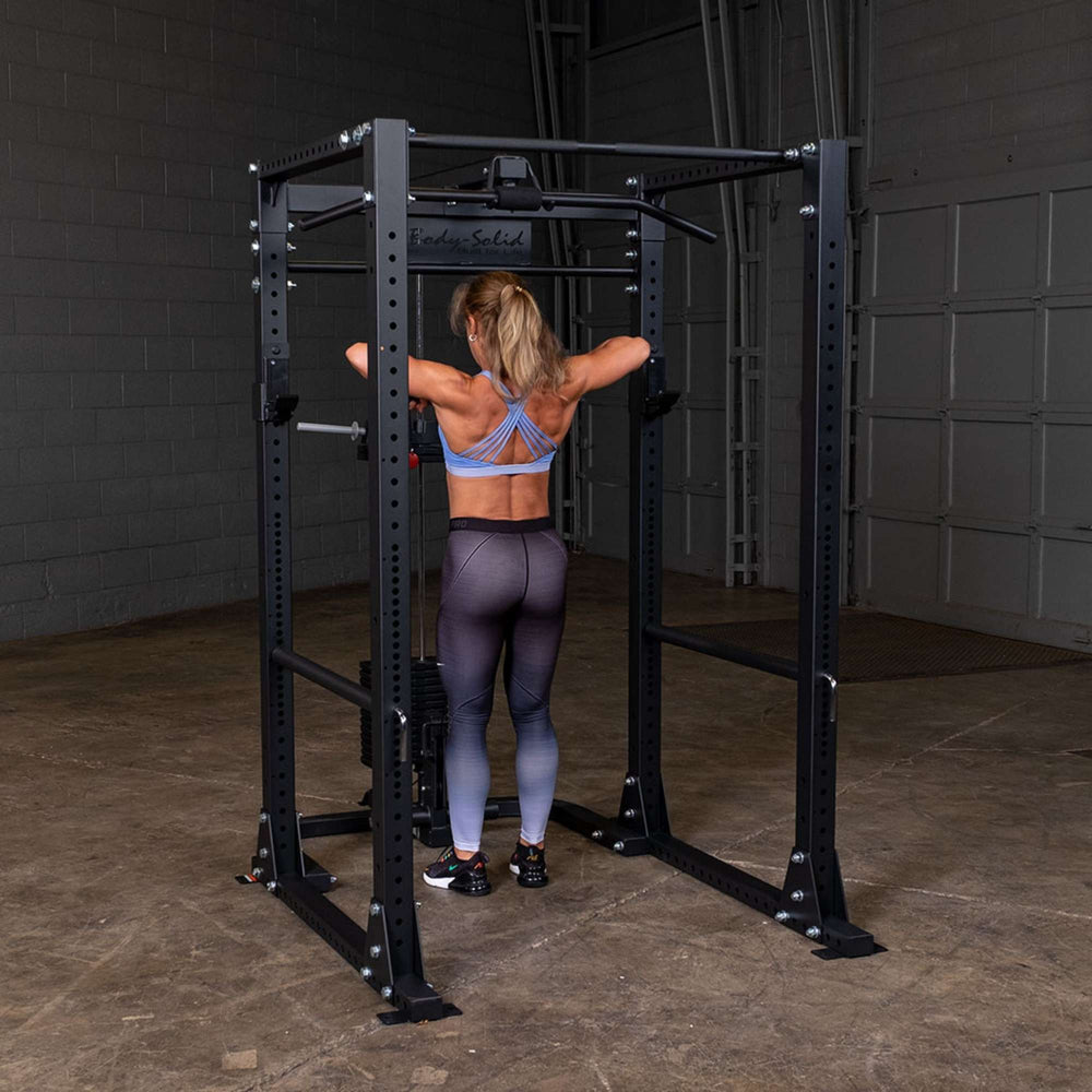 Body-Solid Power Rack Lat Attachment GLA400  a person using a lat attachment upper handle