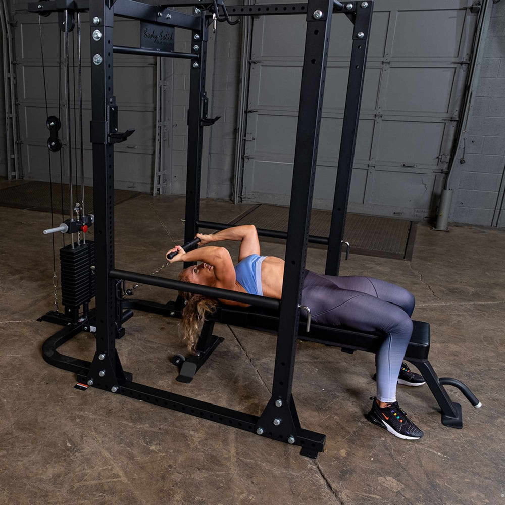 Body-Solid Power Rack Lat Attachment GLA400  a person using a lat attachment while lying on a bench