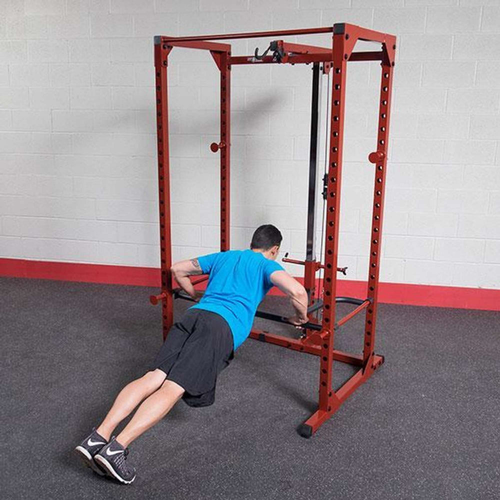 Body-Solid Powerline Dip Attachment for Power Racks DR100 a man PUSH UP performing 