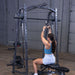 Body-Solid Powerline PSM200 Smith Machine Package PSM200P4 Woman doing lat pulldowns with close-grip handle on Body-Solid Smith Machine