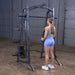 Body-Solid Powerline PSM200 Smith Machine Package PSM200P4 Woman performing triceps rope pushdowns on Body-Solid Smith Machine