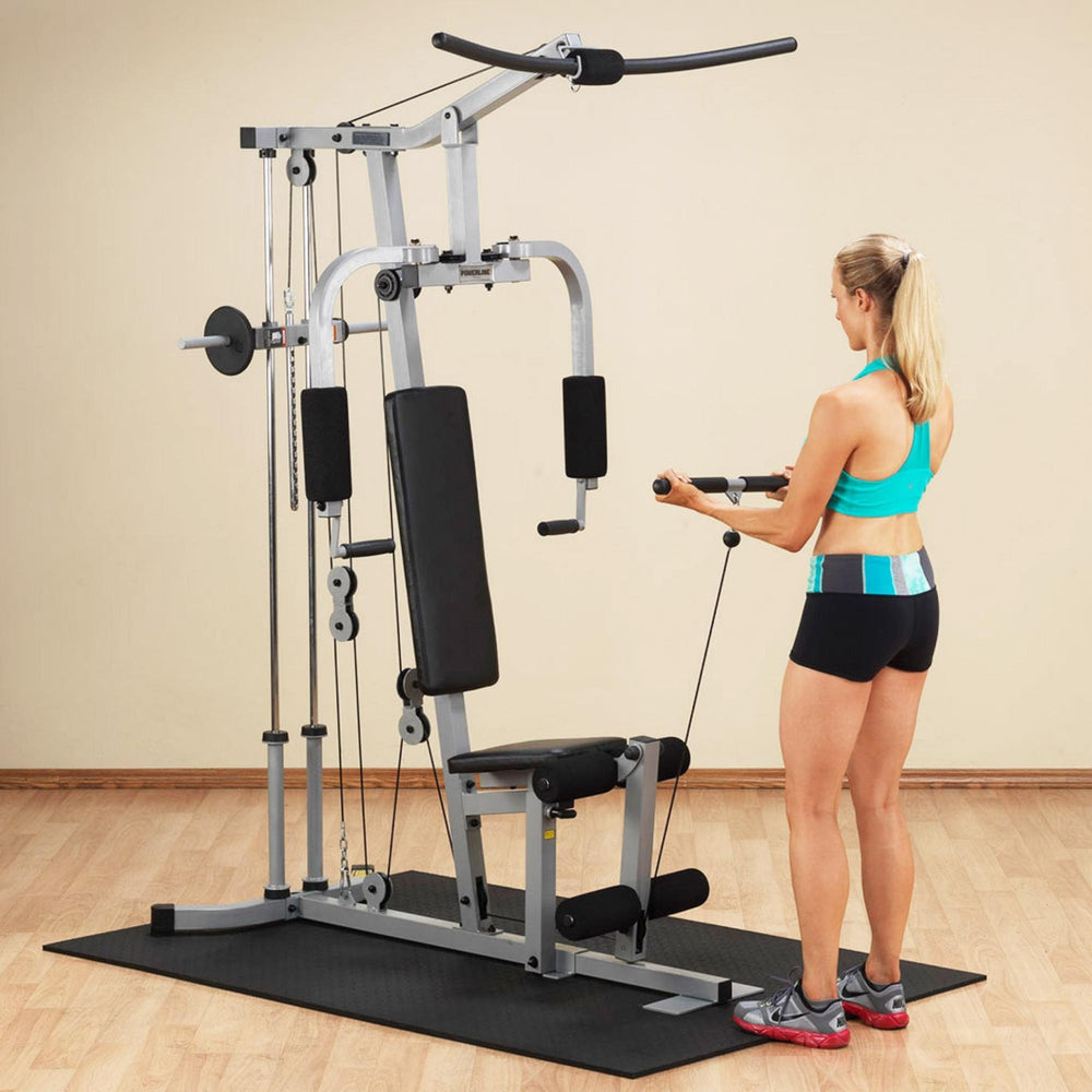 Body-Solid Powerline Plate Load Multi-Station Gym PHG1000X Woman doing cable tricep pushdown exercise