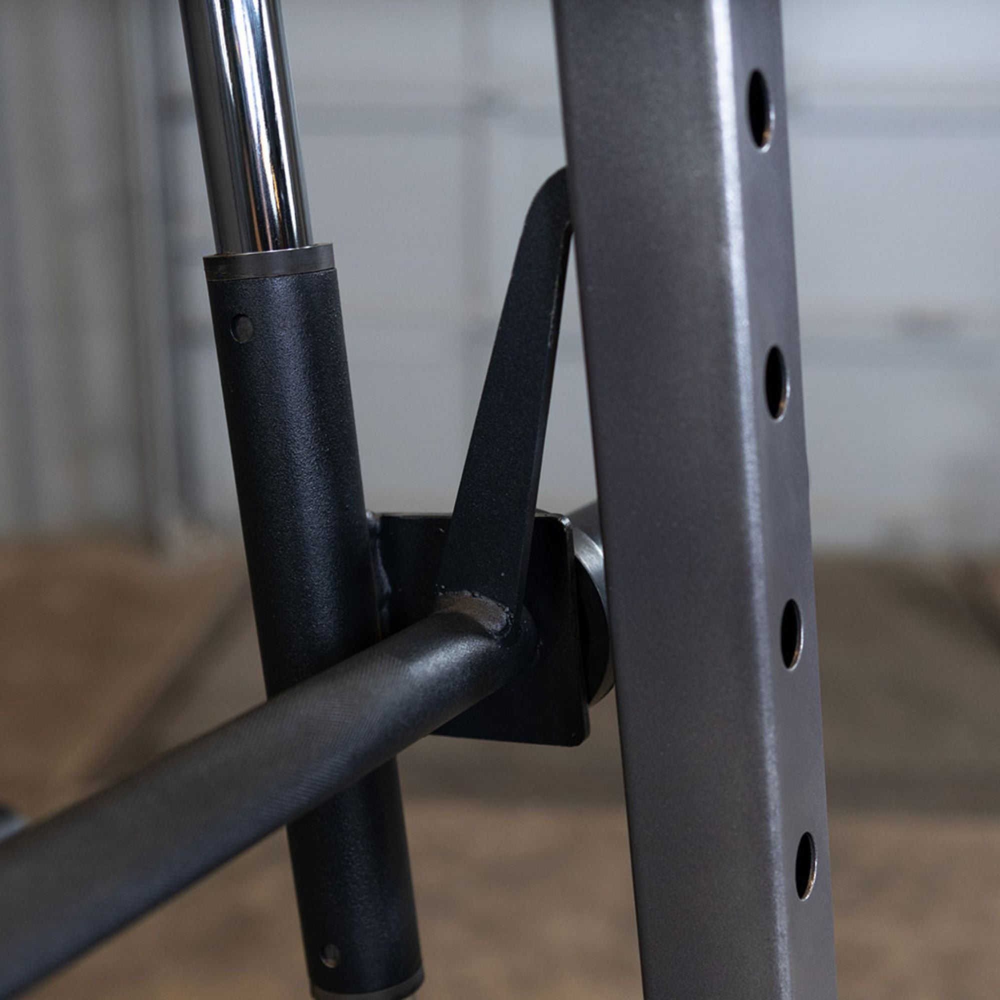 Body-Solid Powerline Smith Machine PSM200 Close-up of Body-Solid Smith machine bar hook mechanism for secure racking