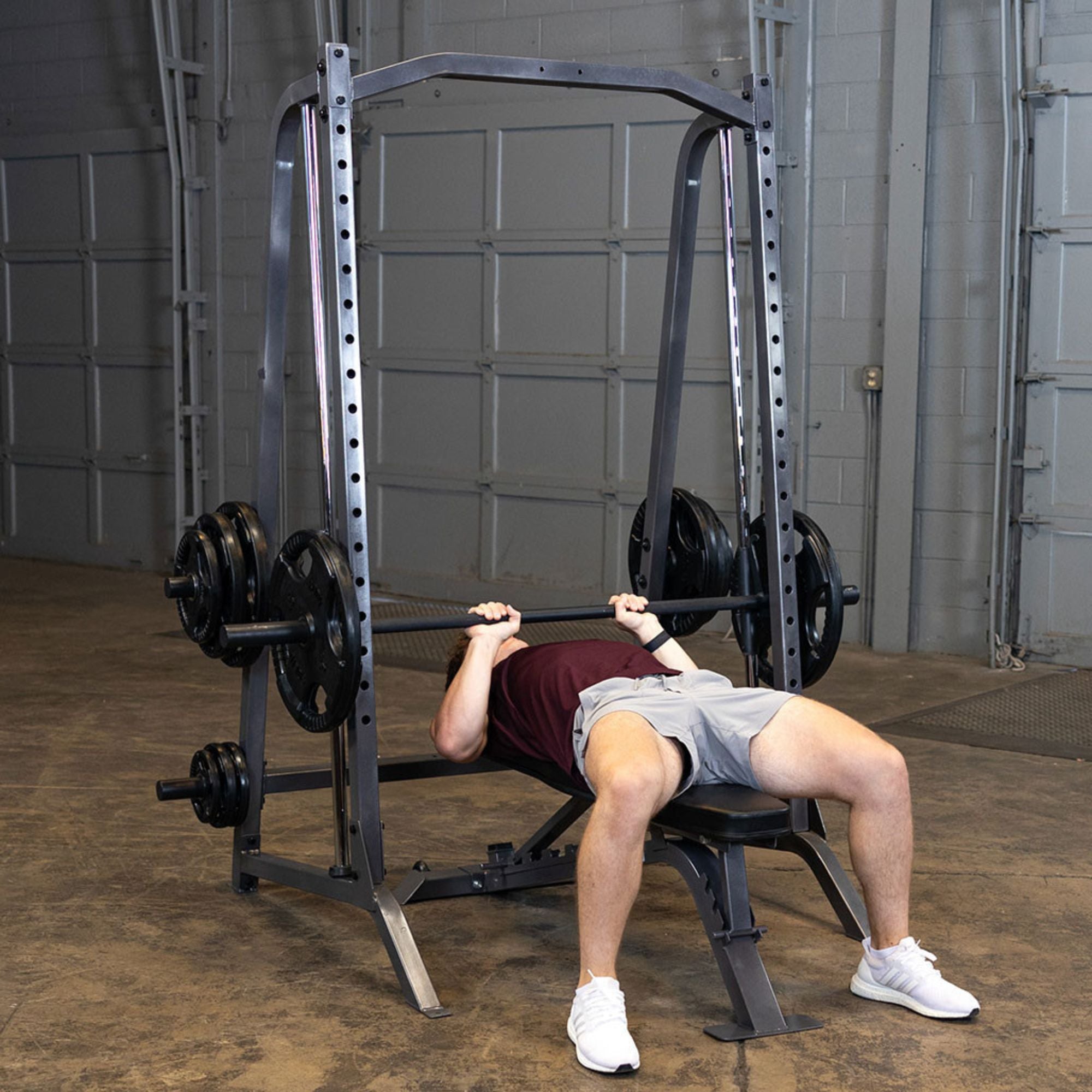 Body-Solid Powerline Smith Machine PSM200 Flat bench press setup on Body-Solid Smith machine with weight plates