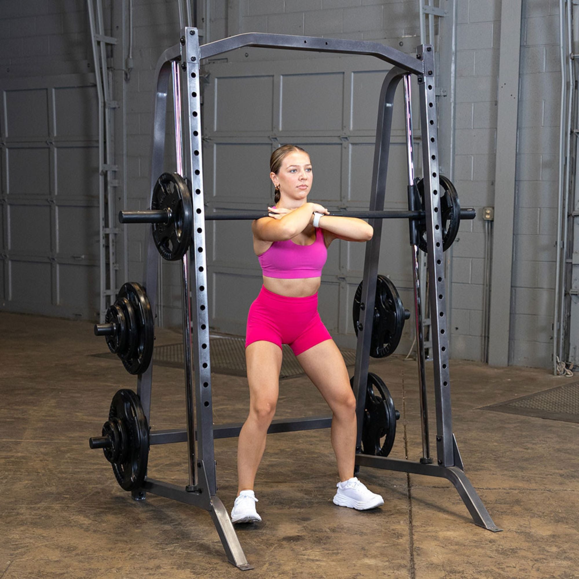 Body-Solid Powerline Smith Machine PSM200 Front squat exercise on Body-Solid Smith machine for quad development