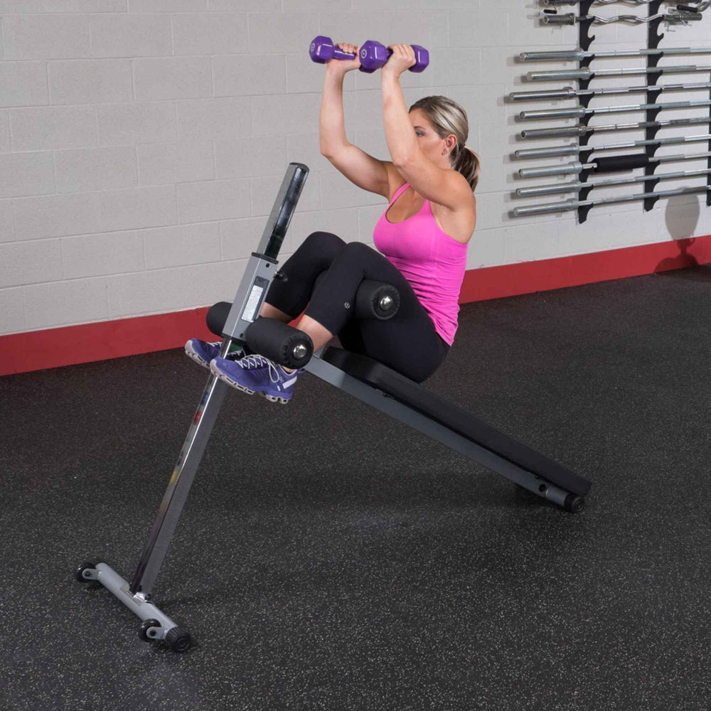 Body-Solid Pro-Style Adjustable Ab Board GAB60B Seated twist crunch with dumbbell on incline bench
