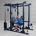 Body-Solid Pro ClubLine Functional Trainer Attachment SPRFTS Man executing back squat with barbell on Body-Solid SPRFTS power rack functional trainer system.
