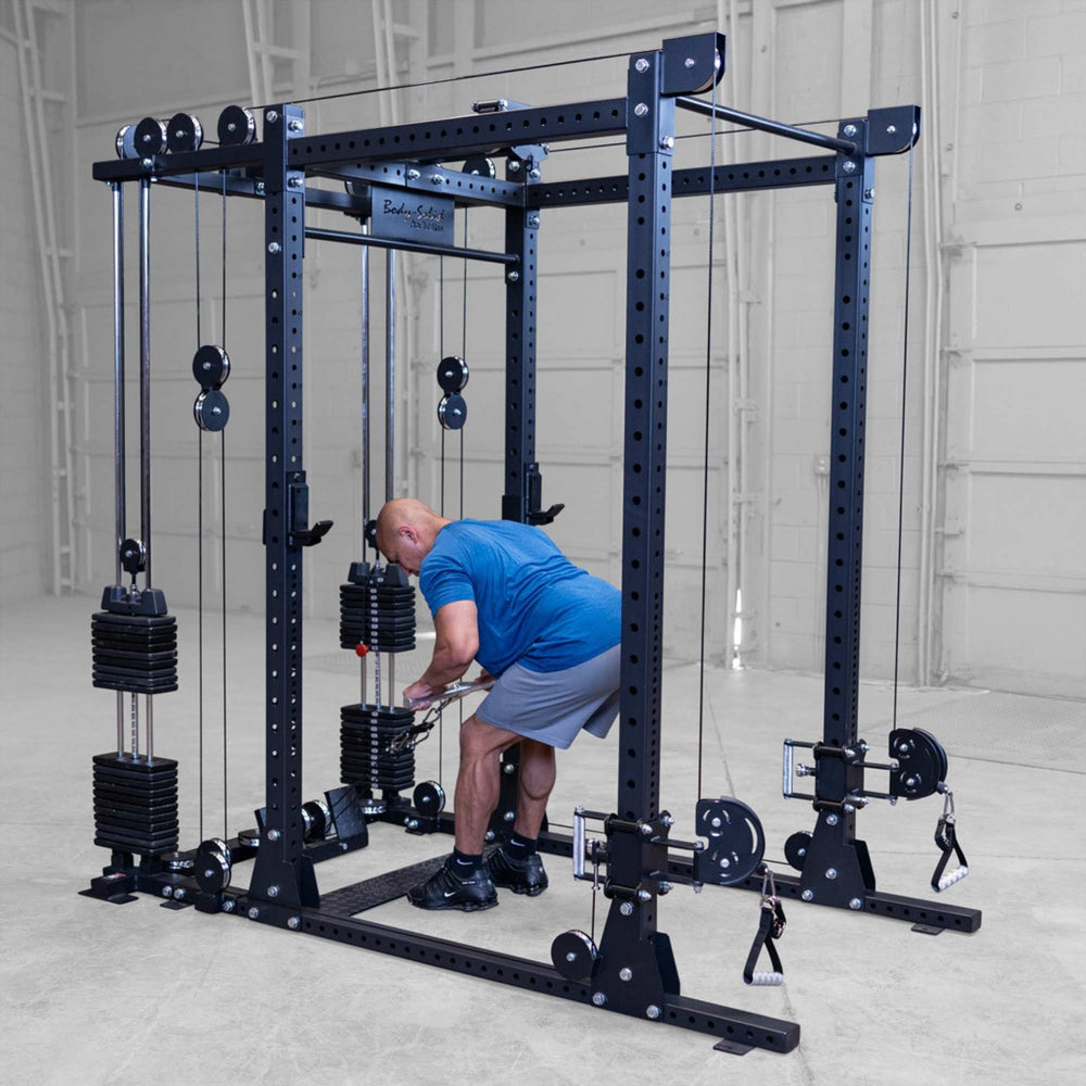 Body-Solid Pro ClubLine Functional Trainer Attachment SPRFTS Man executing overhead shoulder press using cable handles on Body-Solid Pro ClubLine SPRFTS functional trainer.
