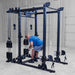 Body-Solid Pro ClubLine Functional Trainer Attachment SPRFTS Man executing overhead shoulder press using cable handles on Body-Solid Pro ClubLine SPRFTS functional trainer.
