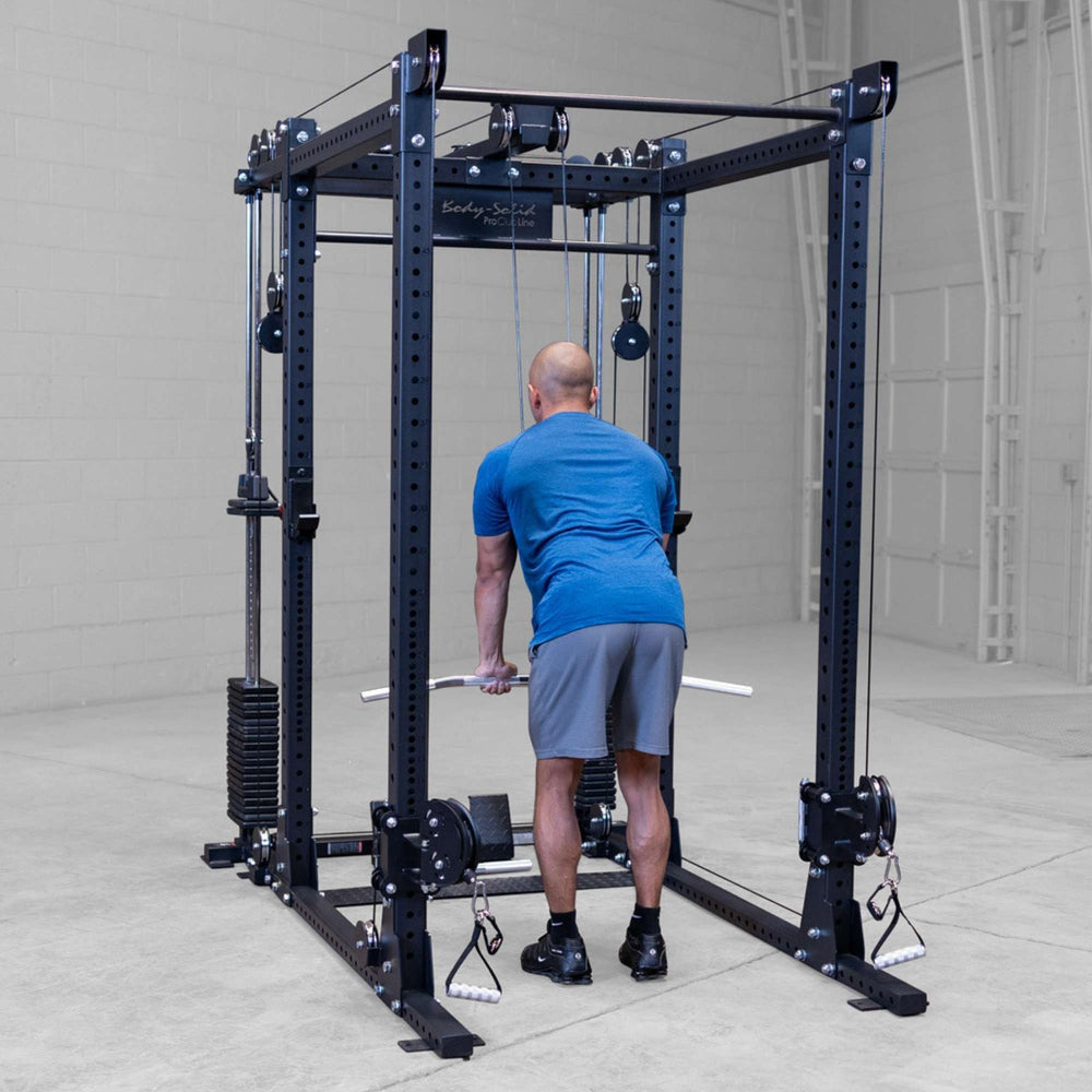 Body-Solid Pro ClubLine Functional Trainer Attachment SPRFTS Man executing triceps pushdown with cable and straight bar attachment on Body-Solid SPRFTS system.
