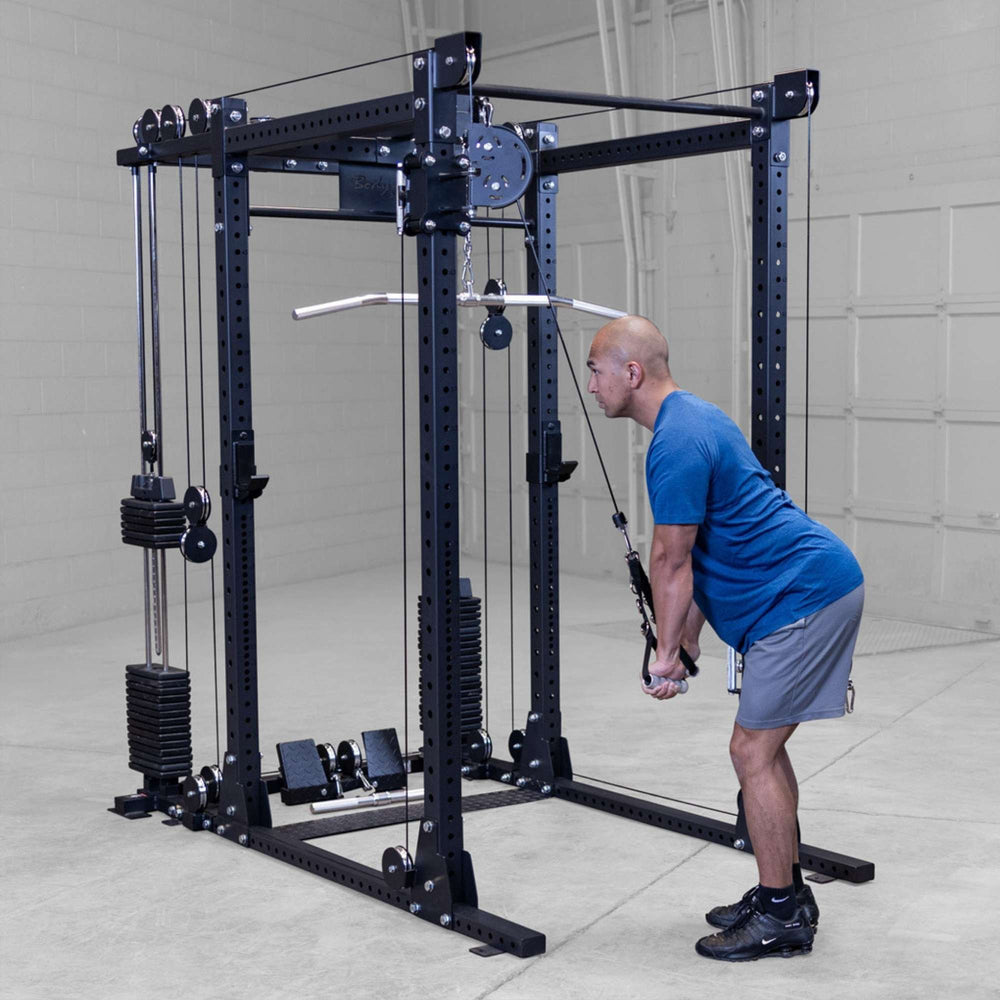 Body-Solid Pro ClubLine Functional Trainer Attachment SPRFTS Man performing bent-over cable row using straight bar on Body-Solid SPRFTS functional trainer power rack.
