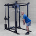Body-Solid Pro ClubLine Functional Trainer Attachment SPRFTS Man performing bent-over cable row using straight bar on Body-Solid SPRFTS functional trainer power rack.
