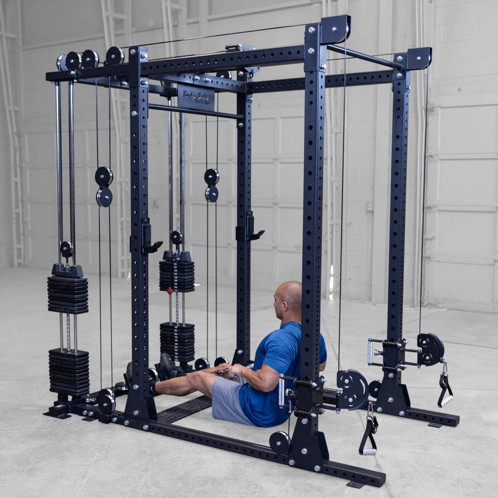 Body-Solid Pro ClubLine Functional Trainer Attachment SPRFTS Man performing seated cable row exercise on Body-Solid SPRFTS functional trainer attachment for back strengthening.

