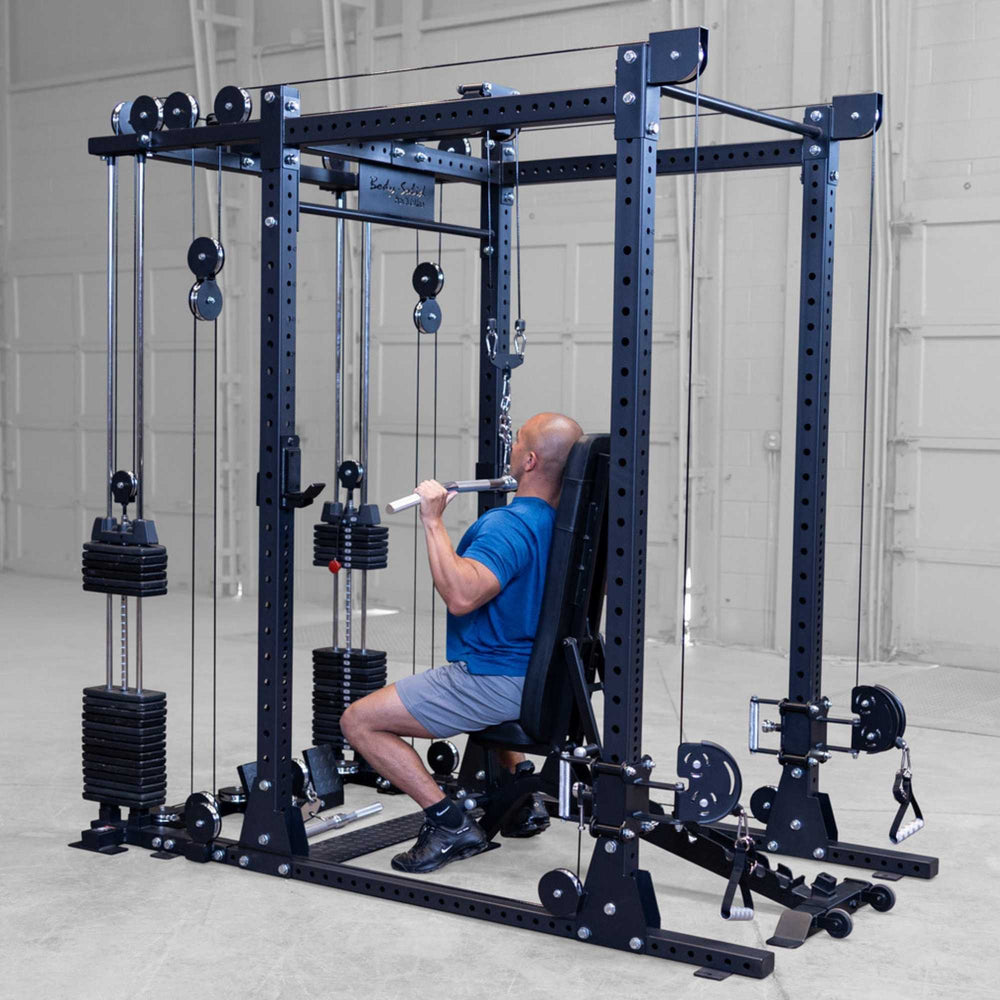 Body-Solid Pro ClubLine Functional Trainer Attachment SPRFTS Man performing seated lat pulldown exercise with straight bar on Body-Solid Pro ClubLine SPRFTS functional trainer.