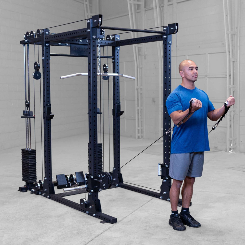 Body-Solid Pro ClubLine Functional Trainer Attachment SPRFTS Man performing standing cable bicep curls on Body-Solid SPRFTS functional trainer attachment for arm strength training.
