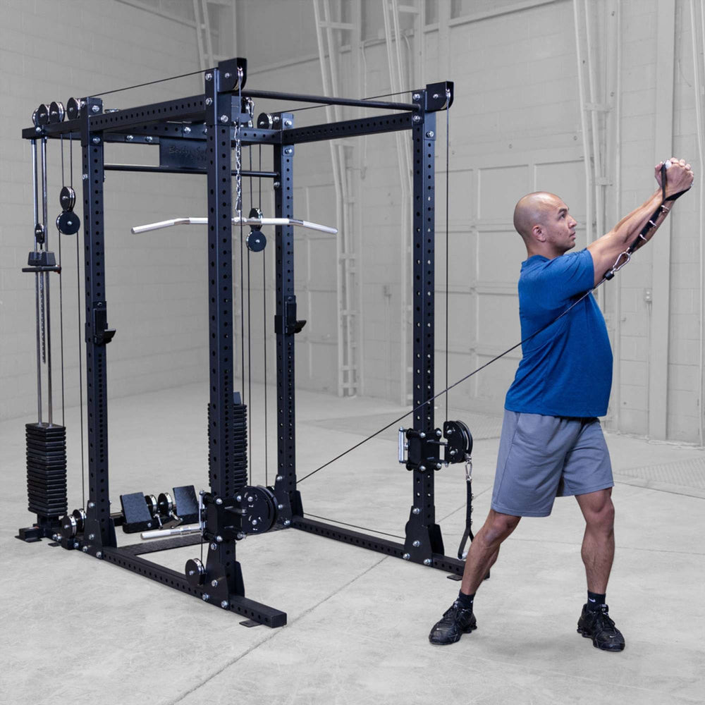 Body-Solid Pro ClubLine Functional Trainer Attachment SPRFTS Man performing standing cable wood chop exercise using single handle on Body-Solid SPRFTS functional trainer.
