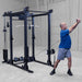 Body-Solid Pro ClubLine Functional Trainer Attachment SPRFTS Man performing standing cable wood chop exercise using single handle on Body-Solid SPRFTS functional trainer.
