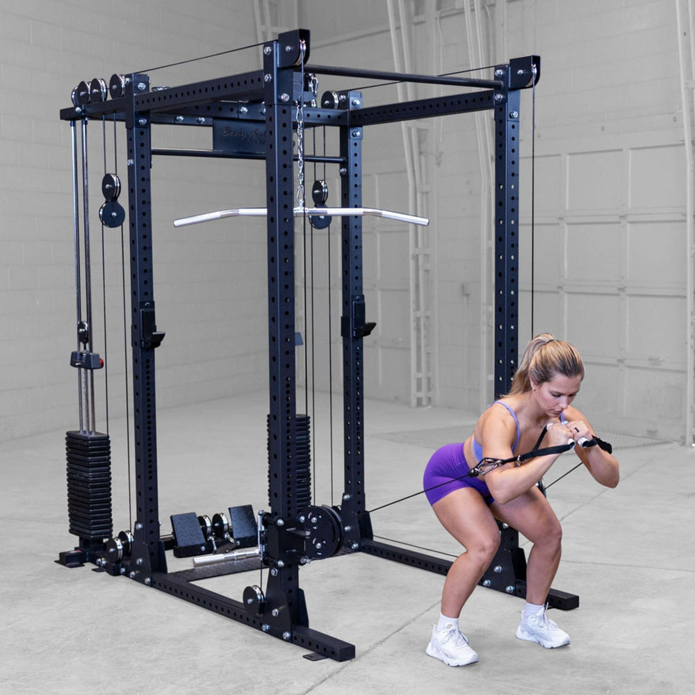 Body-Solid Pro ClubLine Functional Trainer Attachment SPRFTS Woman doing kneeling cable crunches using rope attachment on Body-Solid SPRFTS functional trainer for core training.

