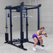 Body-Solid Pro ClubLine Functional Trainer Attachment SPRFTS Woman doing kneeling cable crunches using rope attachment on Body-Solid SPRFTS functional trainer for core training.

