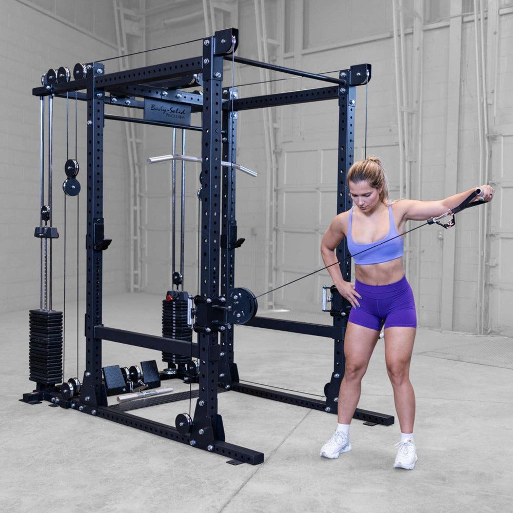 Body-Solid Pro ClubLine Functional Trainer Attachment SPRFTS Woman performing single-arm cable lateral raise on Body-Solid Pro ClubLine SPRFTS functional trainer for shoulder isolation.
