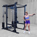 Body-Solid Pro ClubLine Functional Trainer Attachment SPRFTS Woman performing single-arm cable lateral raise on Body-Solid Pro ClubLine SPRFTS functional trainer for shoulder isolation.
