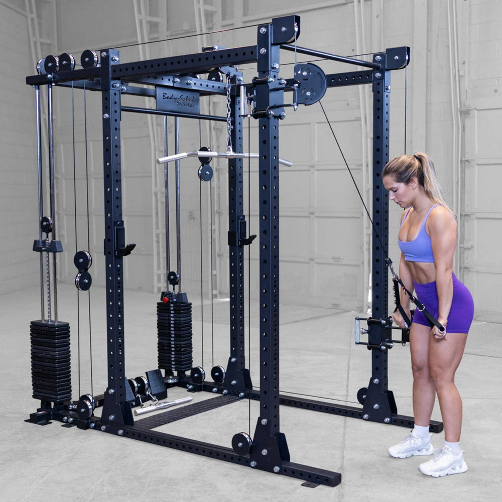 Body-Solid Pro ClubLine Functional Trainer Attachment SPRFTS Woman performing standing shoulder press using dual cable handles on Body-Solid Pro ClubLine SPRFTS functional trainer.
