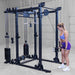 Body-Solid Pro ClubLine Functional Trainer Attachment SPRFTS Woman performing standing shoulder press using dual cable handles on Body-Solid Pro ClubLine SPRFTS functional trainer.
