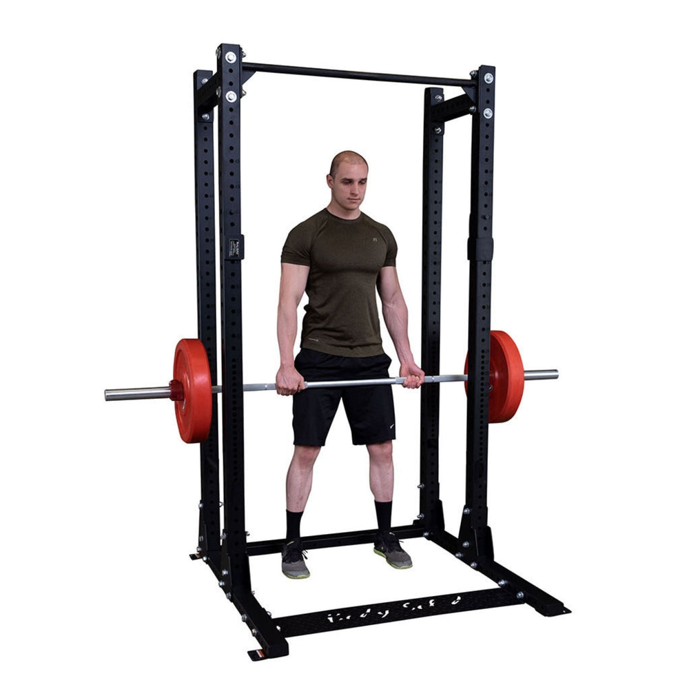 Body-Solid Pro ClubLine Half Rack with Rear Extension SPR500BACK Man doing deadlifts inside Body-Solid power rack