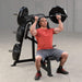 Body-Solid Pro ClubLine LVSP Leverage Shoulder Press LVSPB Man performing overhead press exercise on Body-Solid LVSP Leverage Shoulder Press machine with loaded Olympic plates.
