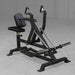 Body-Solid Pro ClubLine LVSR Leverage Seated Row LVSRB Close-up of Body-Solid LVSR seated row machine loaded with black Body-Solid Olympic weight plates, set in commercial gym environment.
