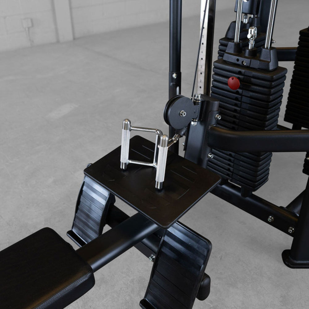 Body-Solid Pro ClubLine SJG Jungle Gym SJG800 Footplate and seated row attachment on a Body-Solid Pro Club Line gym system for back and arm workouts.
