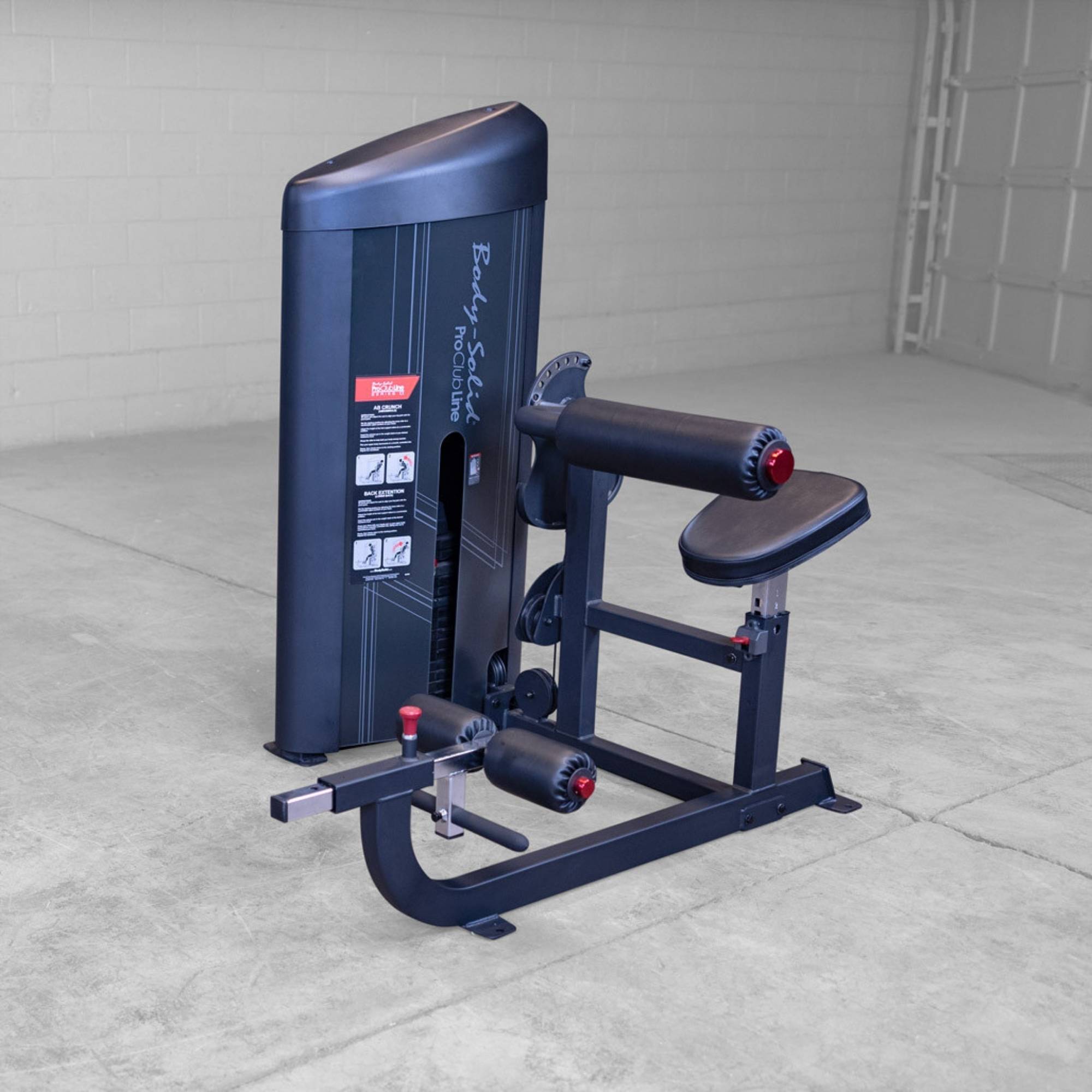 Body-Solid Pro ClubLine Series 2 Ab and Back S2ABBX Side-view display of the Body-Solid ProClubLine machine used for leg extension and hamstring curls in a commercial gym.
