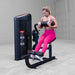 Body-Solid Pro ClubLine Series 2 Ab and Back S2ABBX Woman completing leg curl movement on Body-Solid ProClubLine lower body workout machine with padded rollers.
