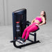 Body-Solid Pro ClubLine Series 2 Ab and Back S2ABBX Woman performing seated leg extensions leaning back on a Body-Solid leg machine for quadriceps activation.
