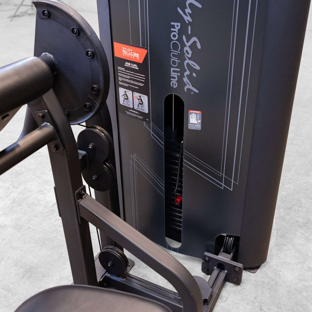 Body-Solid Pro ClubLine Series 2 Arm Curl S2ACX Close-up of Body-Solid ProClubLine arm curl machine weight stack and instructional placard on the side panel.