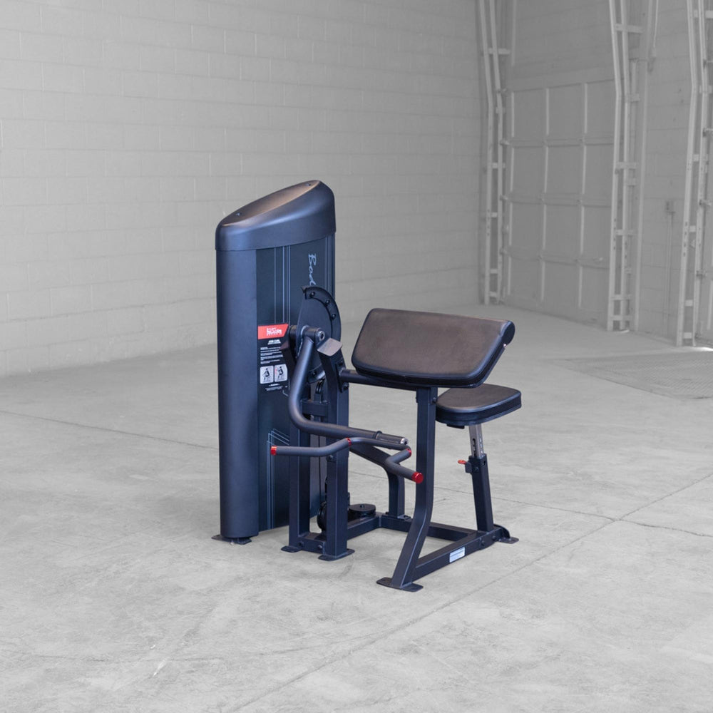 Body-Solid Pro ClubLine Series 2 Arm Curl S2ACX positioned in a spacious gym environment.