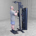 Body-Solid Pro ClubLine Series 2 Biceps Triceps S2BTPX Man doing single-rope cable curls, standing upright beside a black Body-Solid gym machine.
