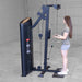 Body-Solid Pro ClubLine Series 2 Biceps Triceps S2BTPX Woman performing standing cable bicep curls on a black Body-Solid cable machine inside a spacious gray gym.