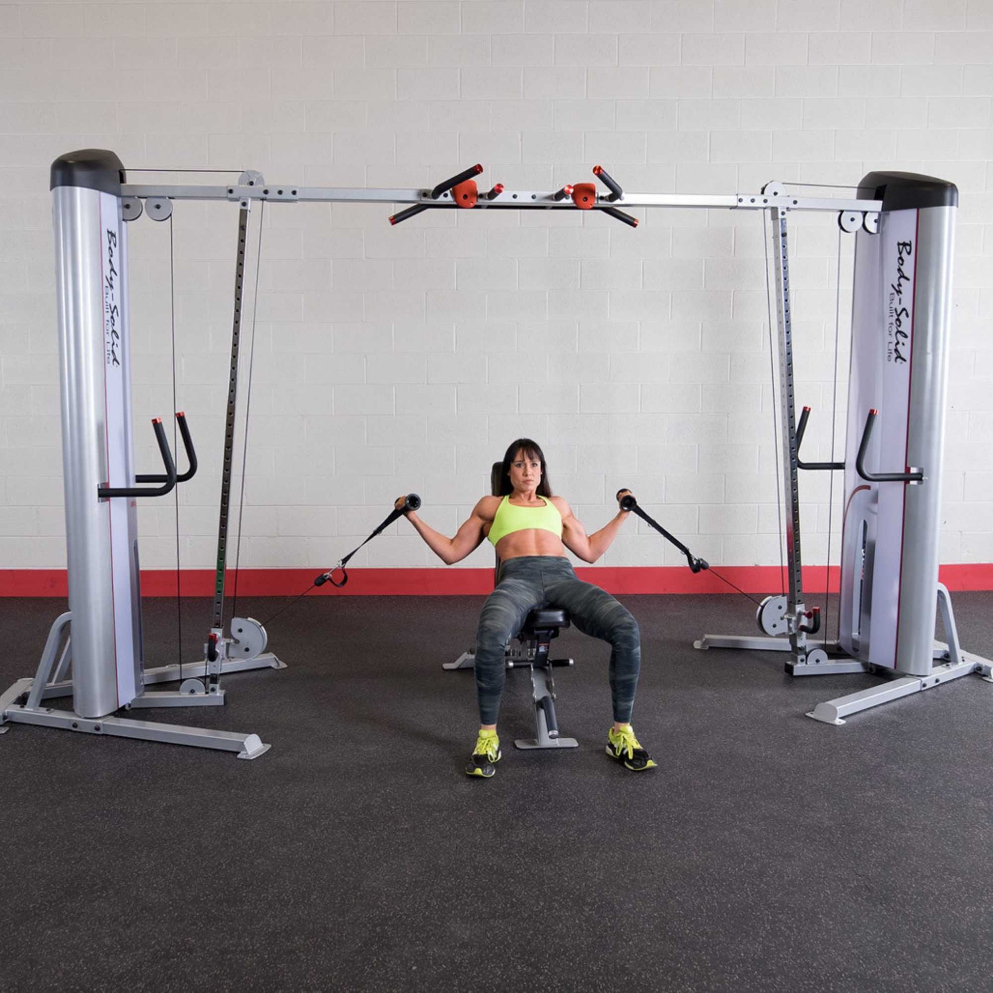 Body-Solid Pro ClubLine Series 2 Cable Crossover S2CCO  Wide cable fly setup with seated user on  dual adjustable pulley