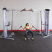Body-Solid Pro ClubLine Series 2 Cable Crossover S2CCO  Wide cable fly setup with seated user on  dual adjustable pulley