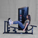 Body-Solid Pro ClubLine Series 2 Leg Calf Press S2LPCX Side view of woman maintaining straight legs on leg press machine, demonstrating proper finishing position