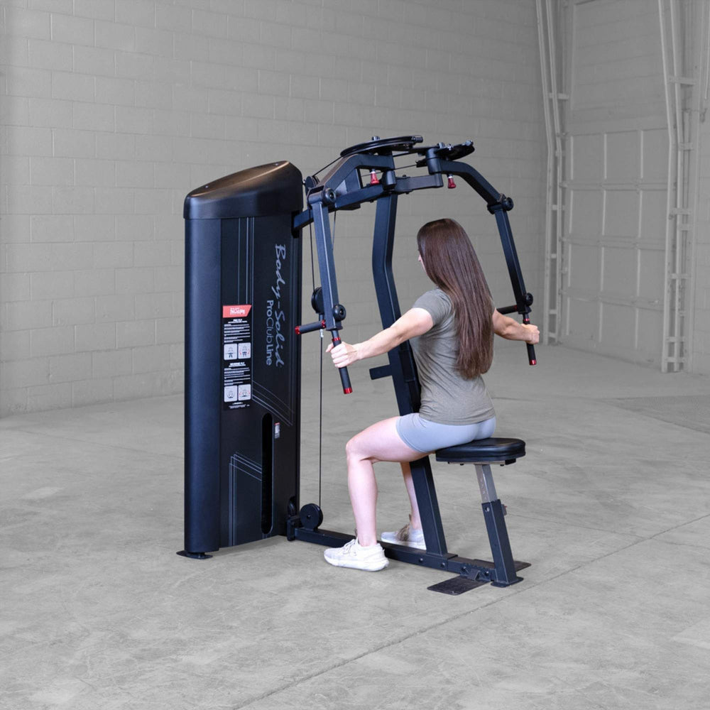 Body-Solid Pro ClubLine Series 2 Pec Delt S2PECX Woman seated on Body-Solid ProClub Line machine performing rear delt fly with handles behind her