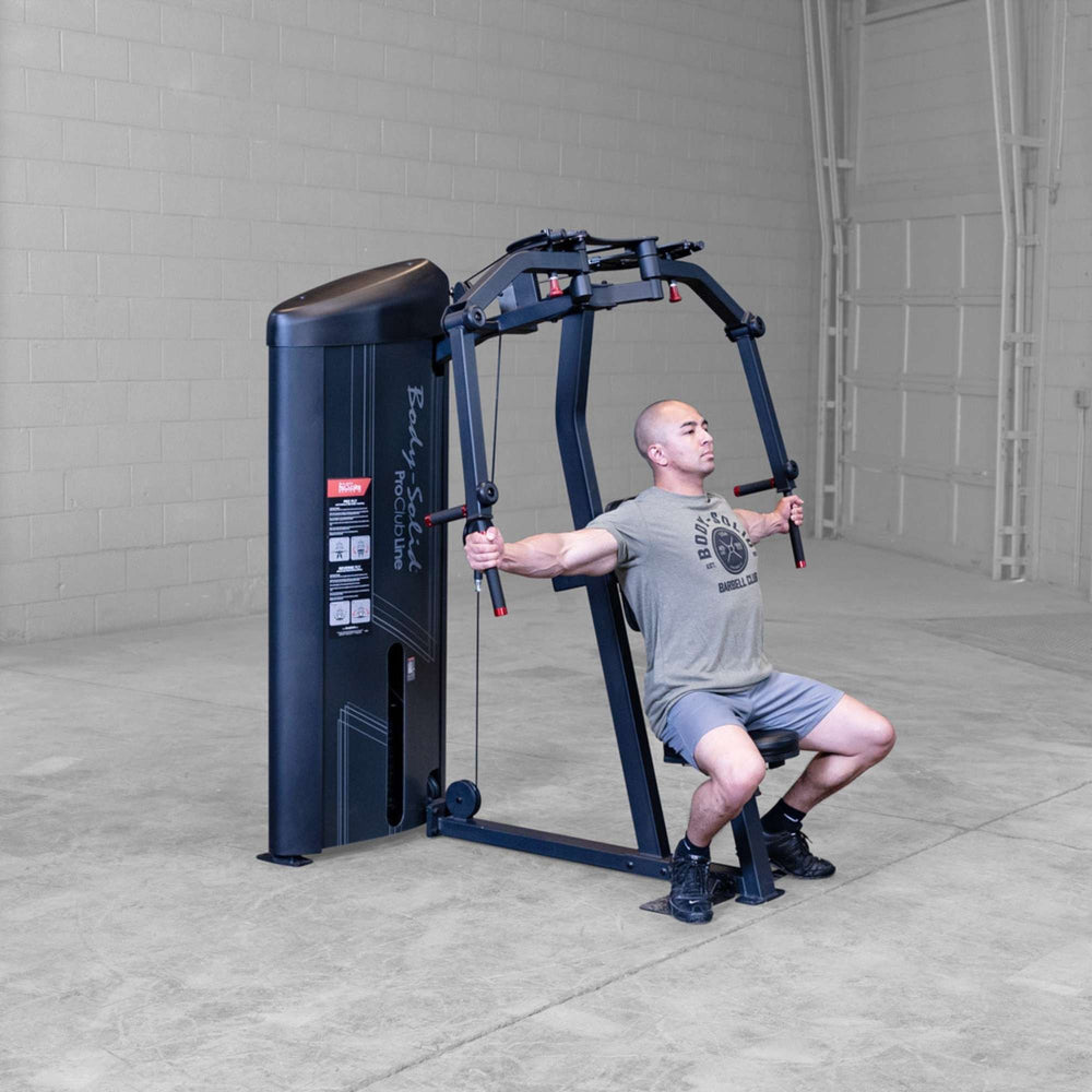 Body-Solid Pro ClubLine Series 2 Pec Delt S2PECX Man using Body-Solid ProClub Line machine performing chest fly with arms opening outward