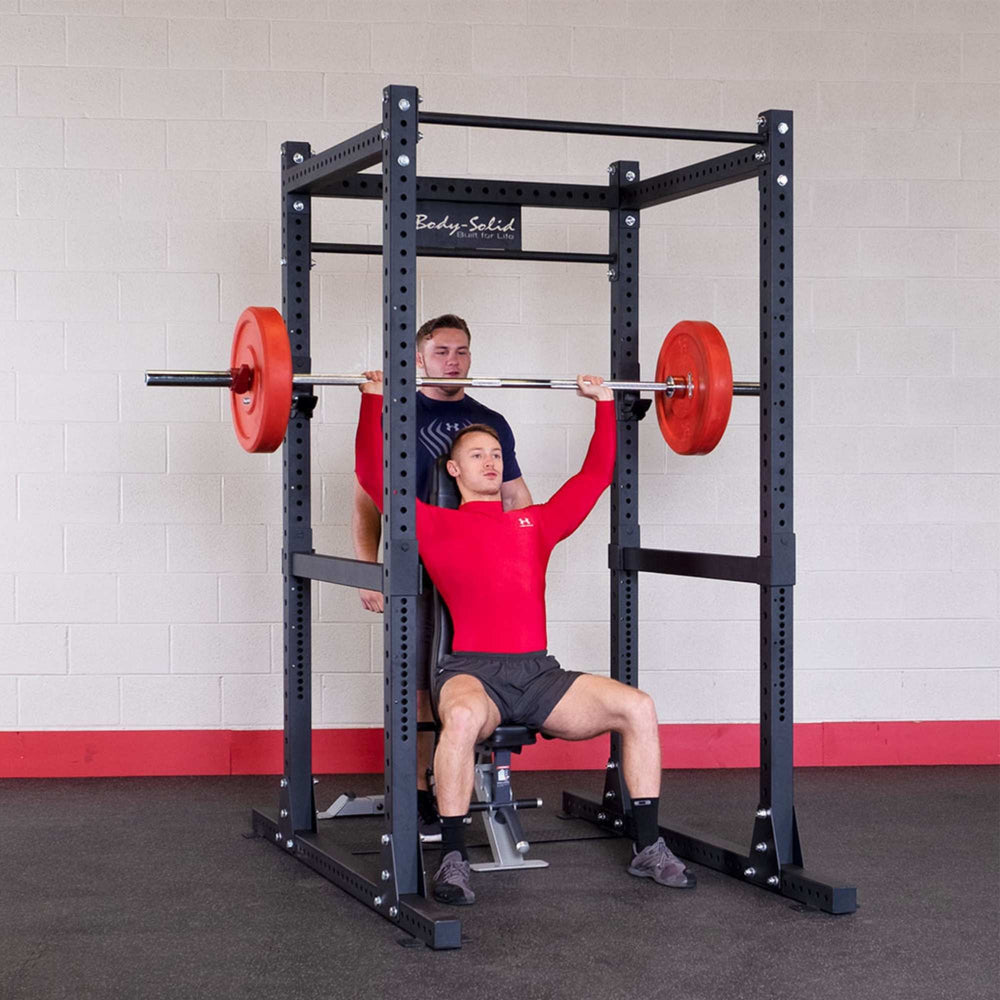 Body-Solid Pro Club Line Power Rack SPR1000 User performing Military Press