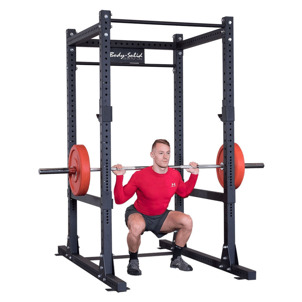 Body-Solid Pro Club Line Power Rack SPR1000 a person performing a barbell squat