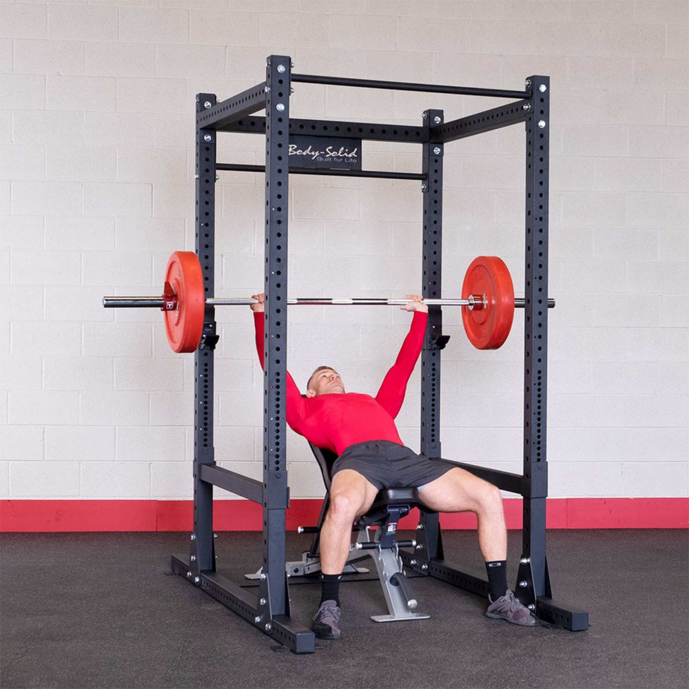 Body-Solid Pro Club Line Power Rack SPR1000  with a person performing an incline bench press
