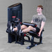 Body-Solid Pro Clubine Series 2 Leg Curl and Extension S2LECX Man performing a seated leg extension on the black machine, demonstrating the top position of the exercise 