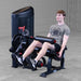 Body-Solid Pro Clubine Series 2 Leg Curl and Extension S2LECX Young man Performing the upward phase of the leg extension exercise in a gym setting 