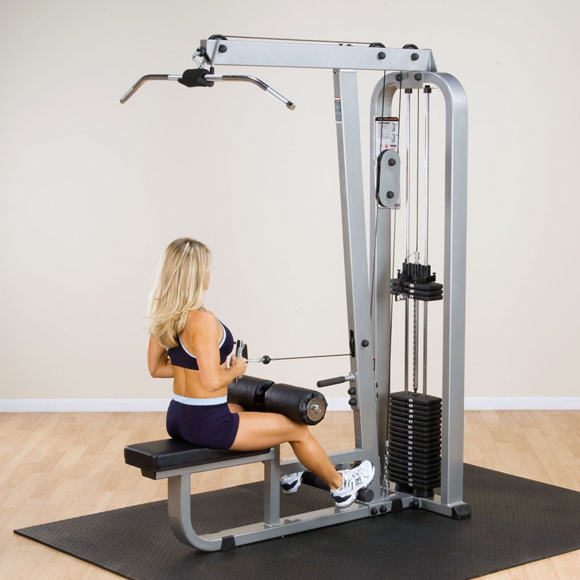 Body-Solid Pro Clubline Lat Mid Row SLM300G Seated cable row exercise by woman on  lat row machine
