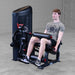 Body-Solid Pro Clubine Series 2 Leg Curl and Extension S2LECX  Young man seated, demonstrating the leg extension exercise in a gym setting 